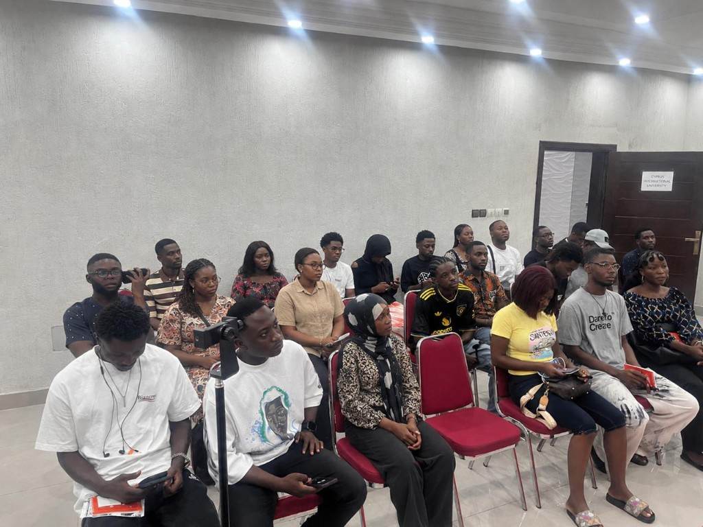Participants seated in a briefing room during a Genef Consults programme.